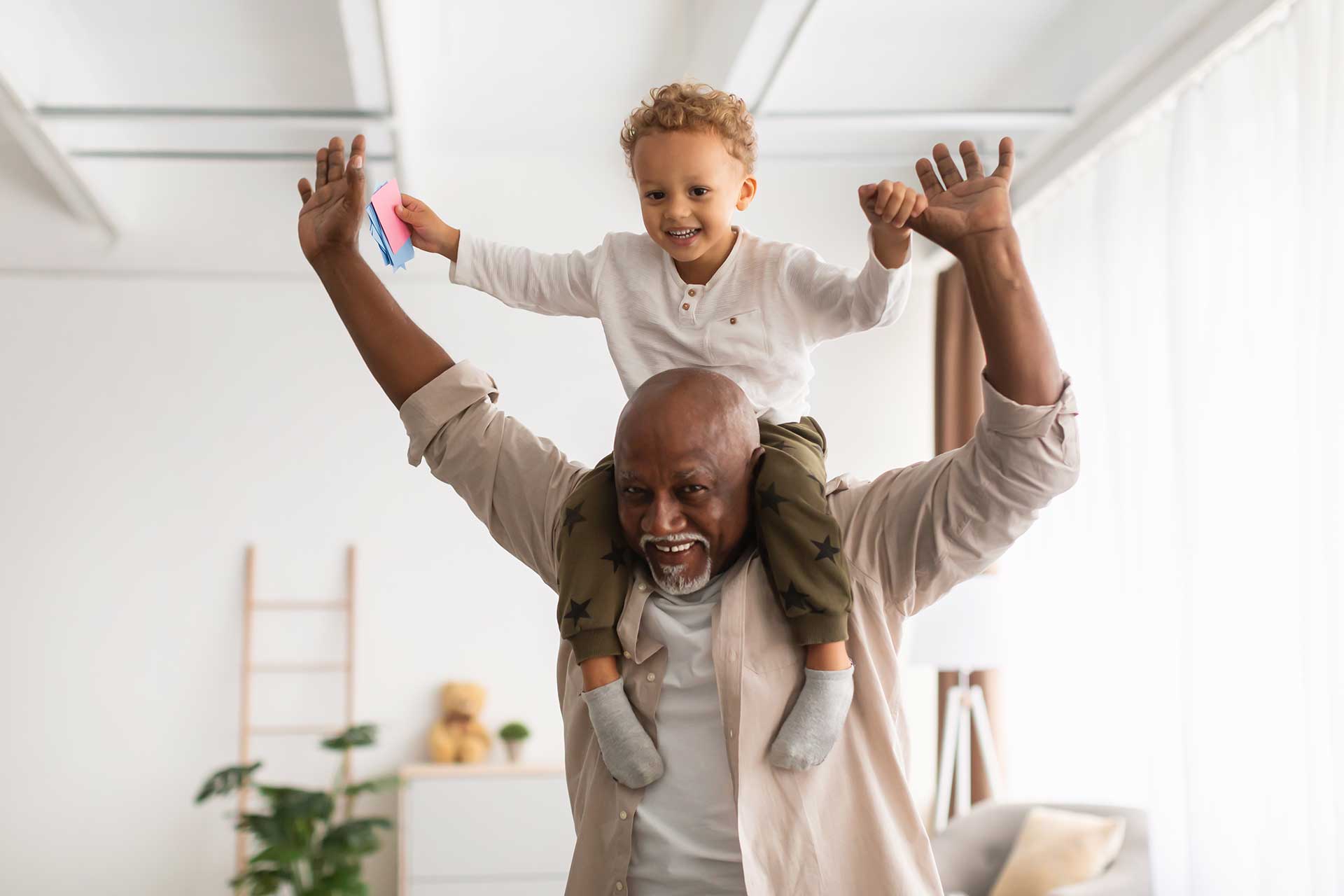 Grandparent Giving Shoulder Ride